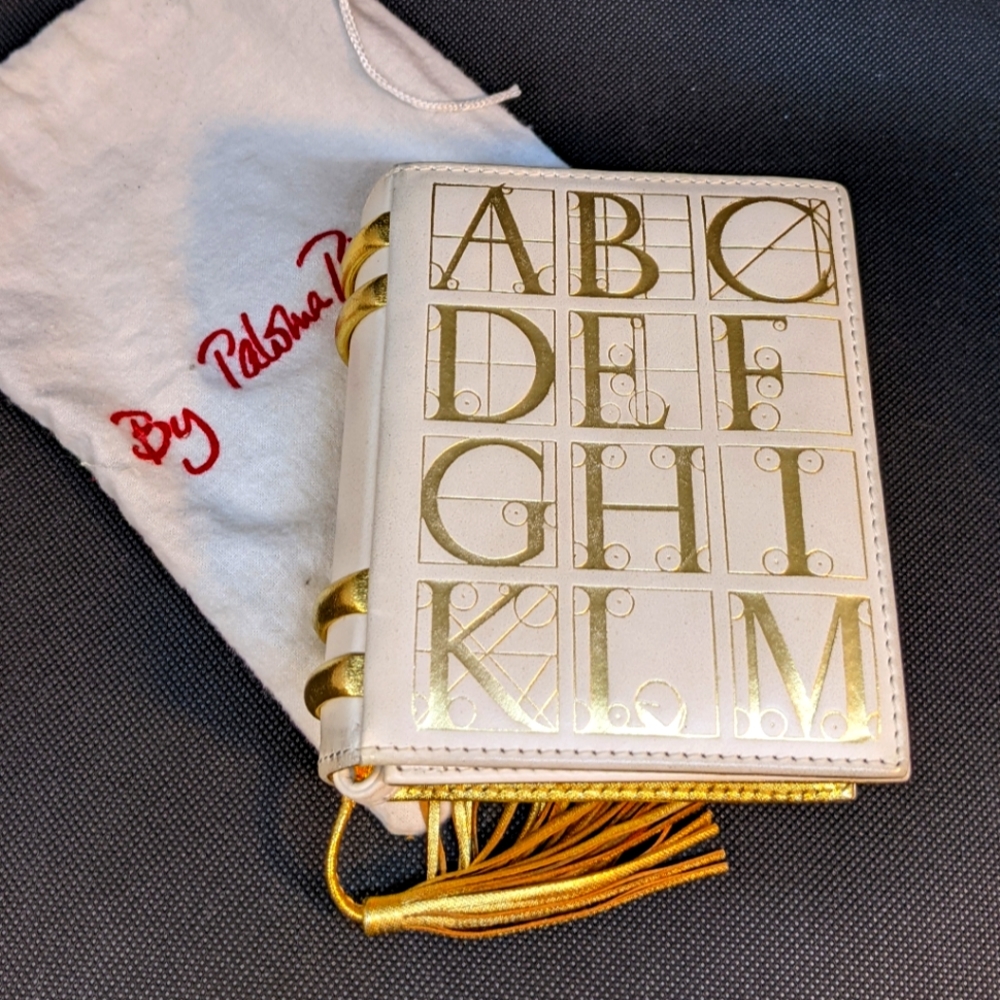 Paloma Picasso alphabet mini purse. Cream and gold.